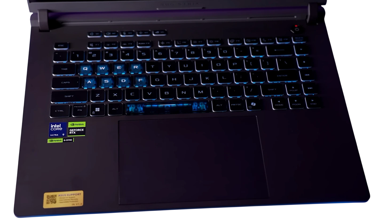 ASUS ROG Strix G16 keyboard with blue RGB backlight and WASD keys highlighted
